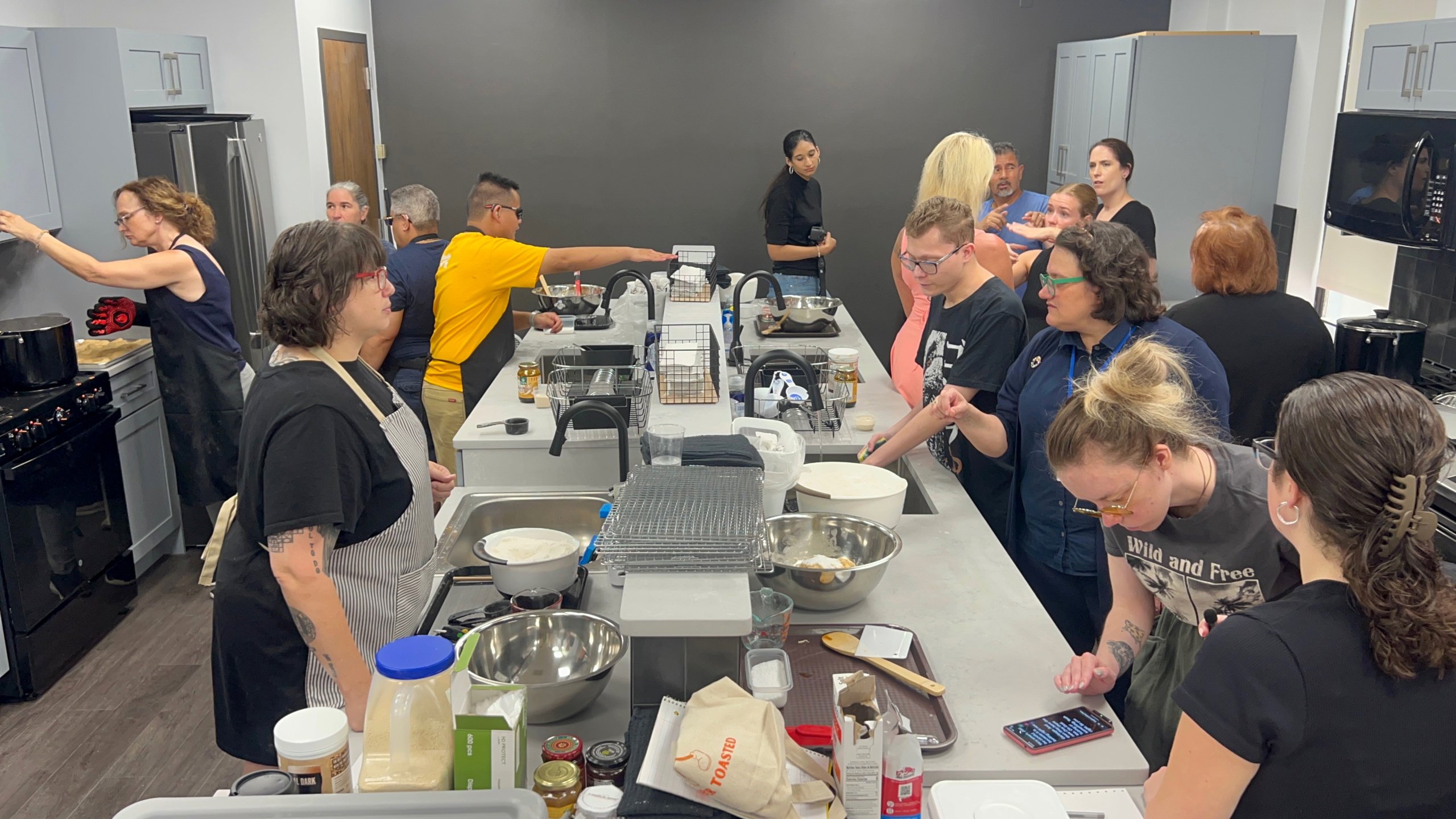 Deaf-blind students making bagels in the renovated HKNC kitchen.